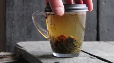green tea with raspberries on a vintage windowsill, making tea