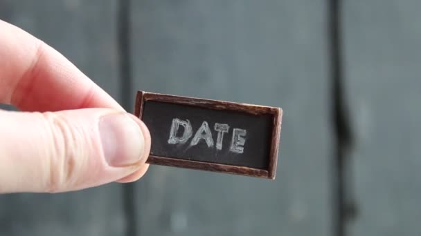 Date tag on the old table, vintage style — Stockvideo