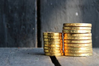 Profit growth, business concept. Graph of gold coins.