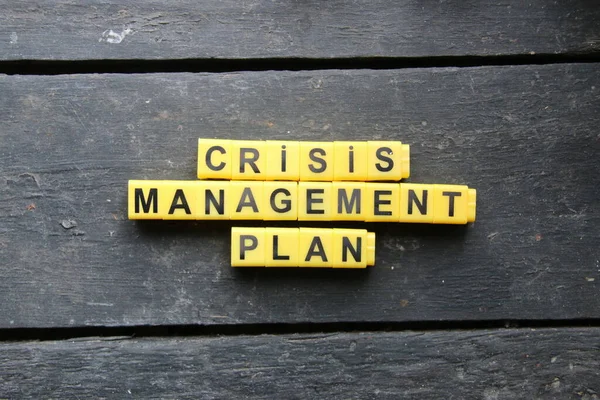 Crisis management plan, inscription on yellow cubes, creative concept, vintage style