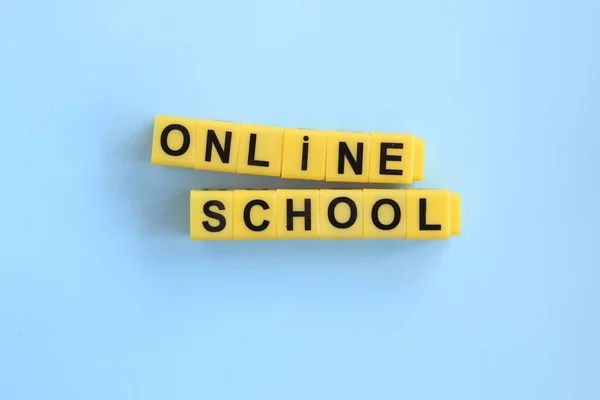 online school, Distance learning online education concept, inscription of yellow cubes on a blue background