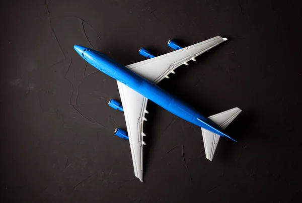 toy passenger plane on a dark background close-up