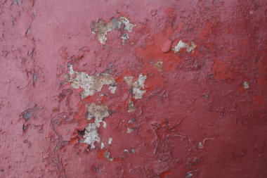 Metal yüzey arkaplan dokusunda kırmızı boya soyuluyor