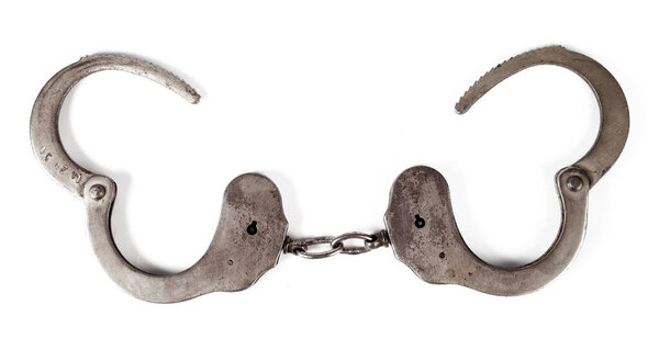 police handcuffs on a white background, isolate, close-up