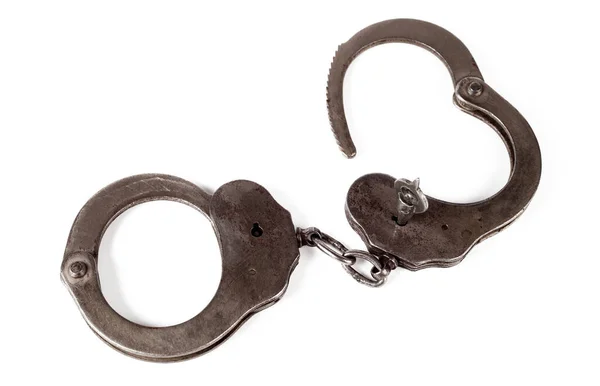 Polis kelepçeleri beyaz arka planda, tecrit, yakın plan.