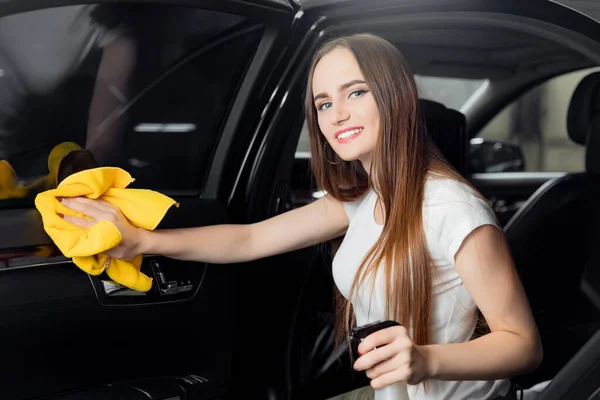 Car wash service, girl worker cleaning spray eco interior modern microfiber and console auto — Stock Photo, Image