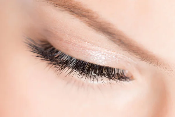 Eyelashes extensions. Lash extension procedure in spa beauty salon