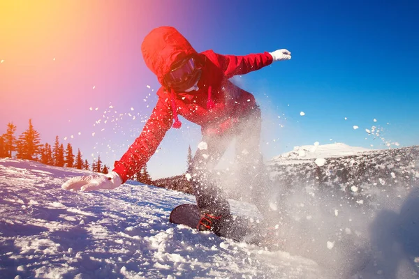 Snowboarder with snowboard rides through snow in forest tramplin. — Stock Photo, Image