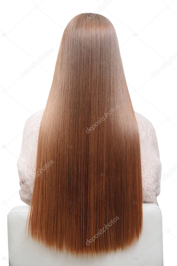 Isolated photo. Girl with beautiful long shiny smooth straight hair in hairdresser chair back. Concept Spa treatments