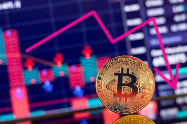 Altın Bitcoin kripto para birimi şafak çizelgesinin arka planında değer kaybı