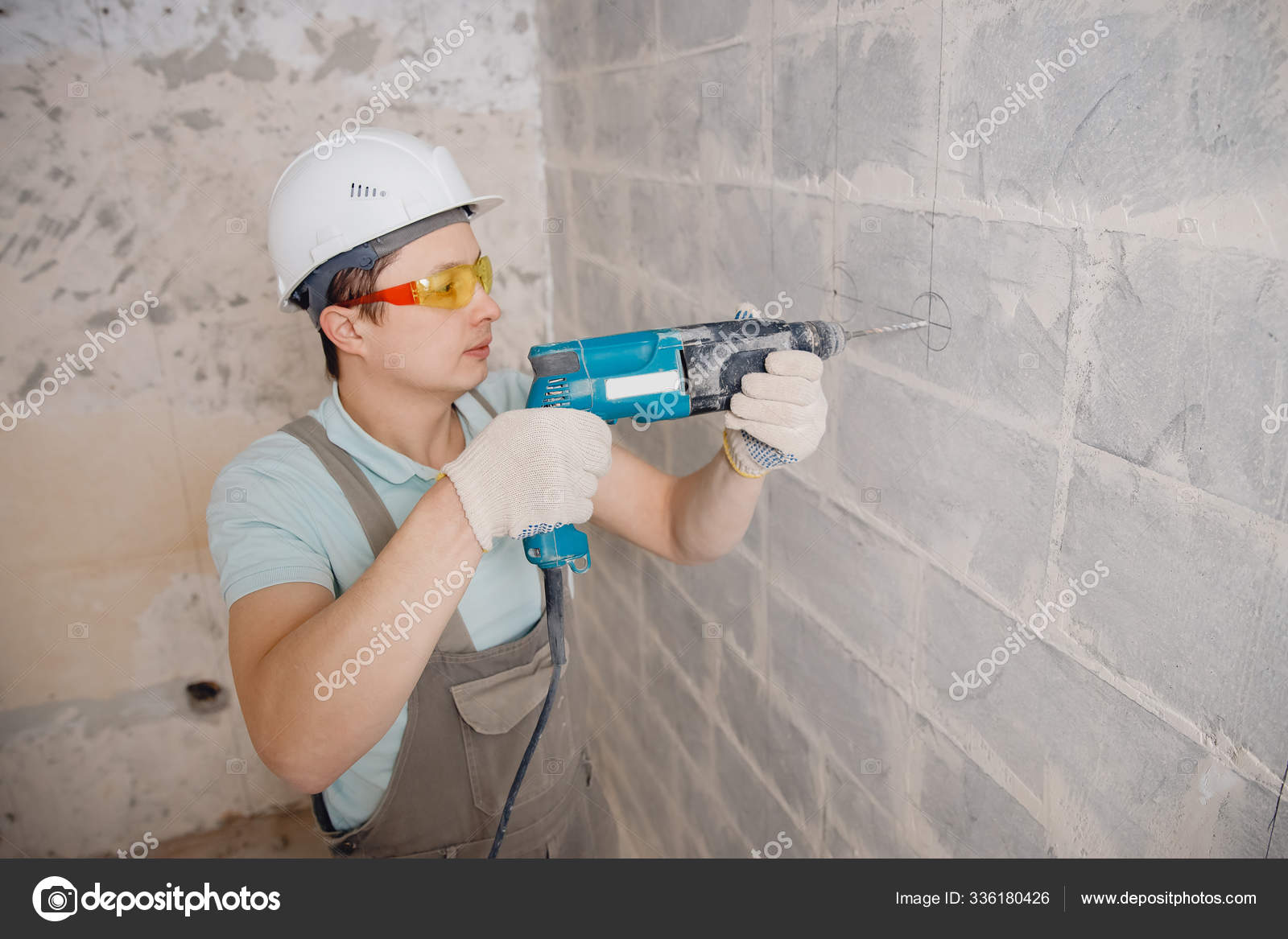 Builder man with pneumatic hammer drill perforator with diamond