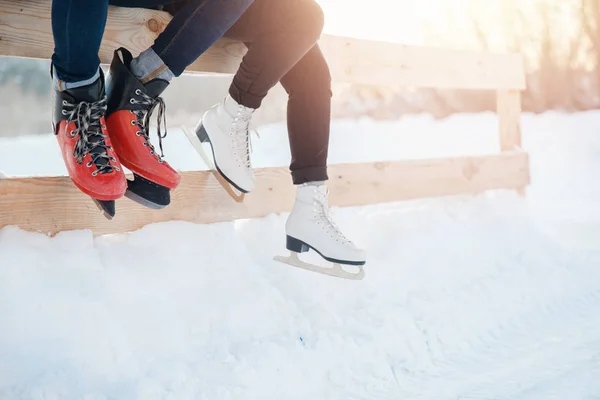 Closeup winter skates on transparent ice rink. Couple in lover — Stock Photo, Image