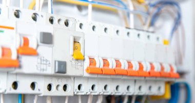 Close up elements of consumer electric control panel switchboard for home enclosure for distribution and power electricity