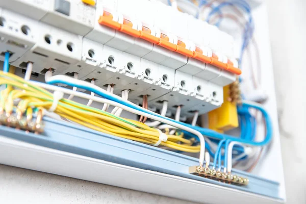 Close up elements copper wires consumer electric control panel switchboard enclosure for distribution and power electricity — Stock Photo, Image