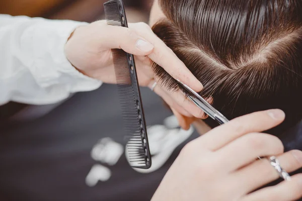 Barber master hairdresser does hairstyle and style with scissors and comb, concept Barbershop for men — Stock Photo, Image