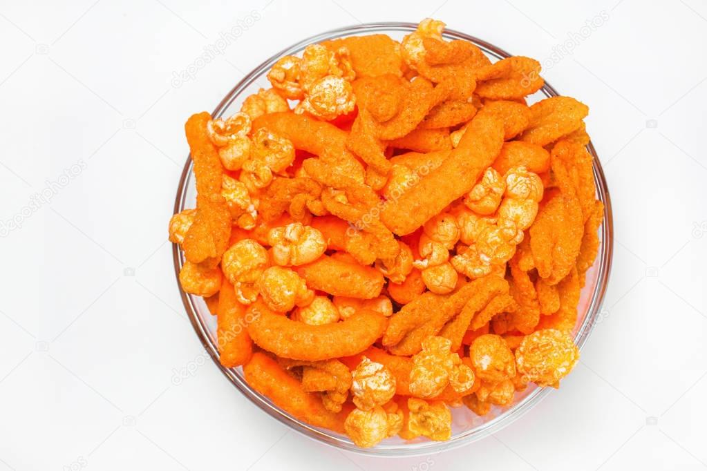 Orange Cheese Puff and popcorn Snack Background from the top