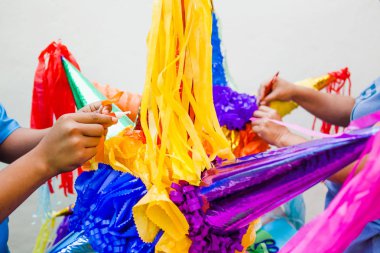 Making a Mexican Pinata handmade for posadas in Christmas in Mexico clipart