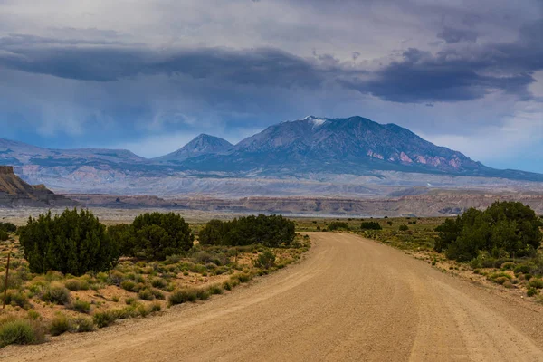 Storm clouds and gravel road in southern Utah — Stock Photo, Image