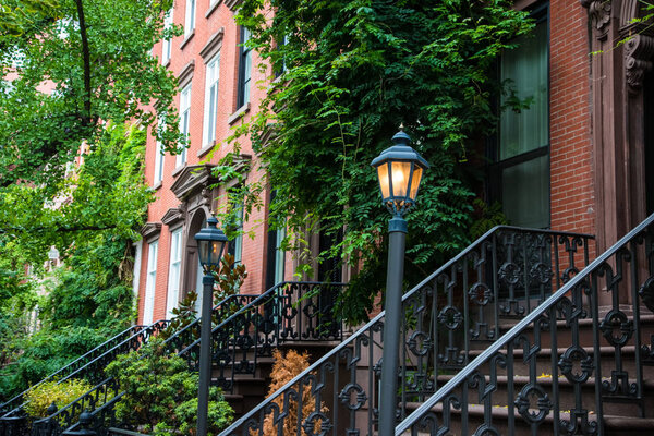 Vintage lamp post near old apartment buildings in Greenwich Village, New York City