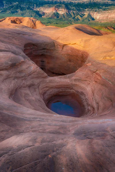 Eroded pits in rock formations at Dance Hall Rock in southern Utah