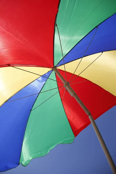 multi-colored beach umbrella to create a shadow