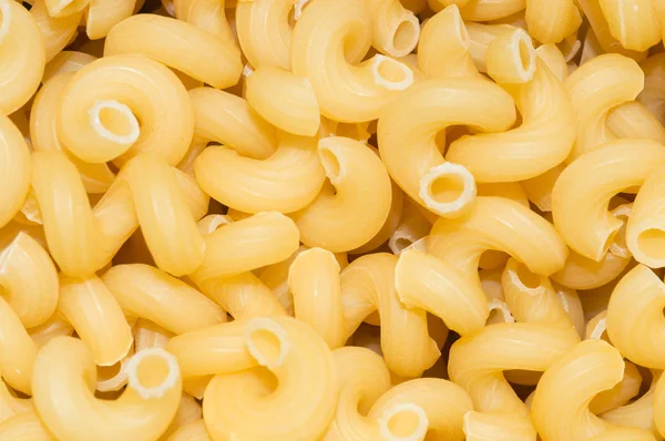 Rå pasta mat bakgrundsstruktur. — Stockfoto