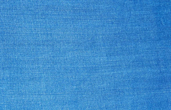 Textilní tkanina modré džíny — Stock fotografie