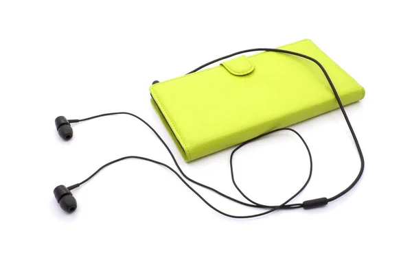 Sluchátka s žlutý mobilní telefon — Stock fotografie