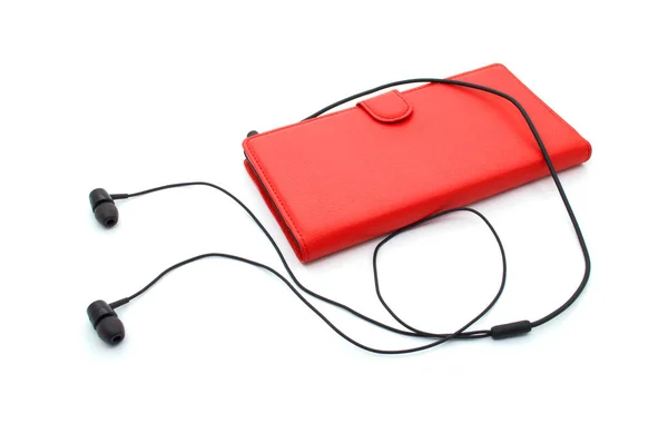 Ακουστικά με κόκκινο κινητό τηλέφωνο — Φωτογραφία Αρχείου