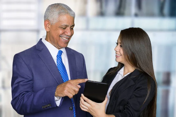 Businesswoman At Work With Senior Client — Stock Photo, Image