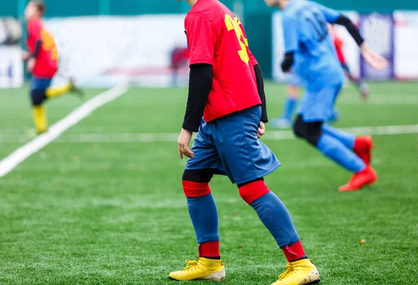 Boys Red Blue Sportswear Plays Football Field Dribbles Ball Young — Stock Photo, Image