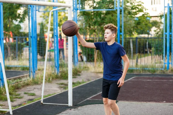 Cute Boy Blue Shirt Plays Basketball City Playground Active Teen — 스톡 사진