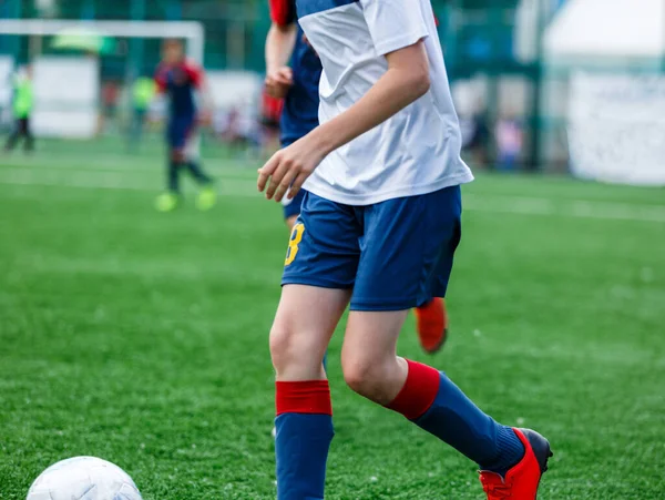 Boys White Blue Sportswear Plays Football Field Dribbles Ball Young — Stock Photo, Image