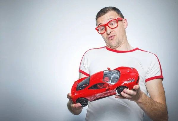Immature man with toy — Stock Photo, Image