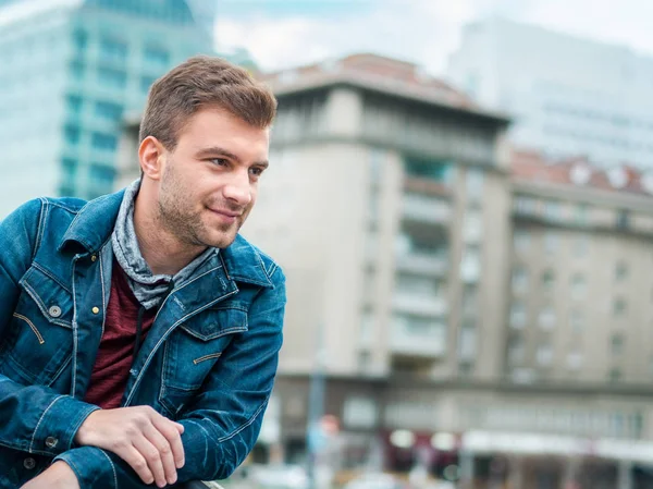 Portrait of young man posing on the street, profile of handsome guy — Stock Photo, Image