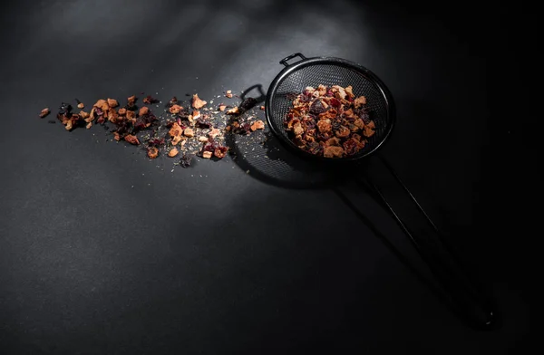 Fruit tea of dried flowers petals and dry berries with strainer — 스톡 사진