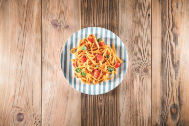 Pasta with tomato sauce and basil. Delicious tagliatelle. Italia