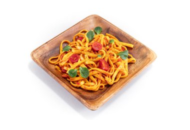 Pasta with tomato sauce and basil. Delicious tagliatelle. Italia