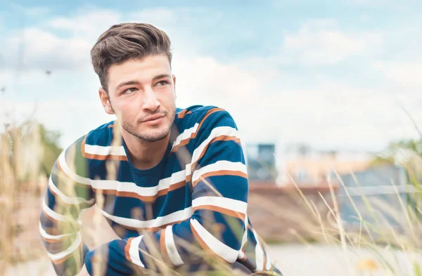 Portrait Beautiful Young Man Neutral Expression Face Posing Grass — Stock Photo, Image