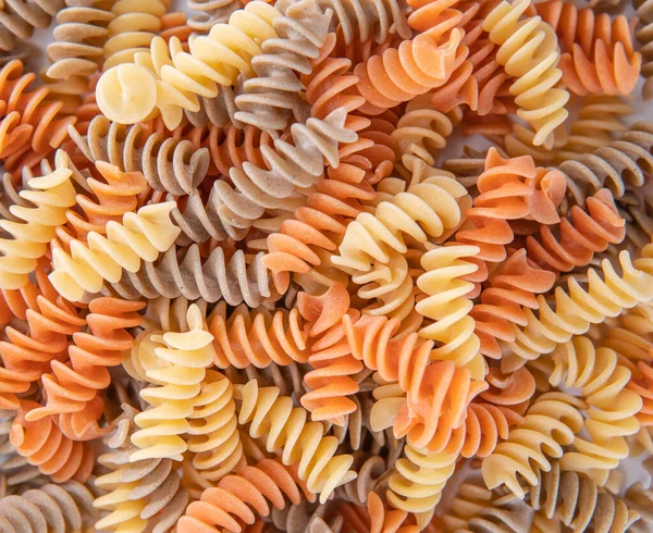 Pile Uncooked Macaroni Much Dry Colorful Spiral Noodle — Stock Photo, Image