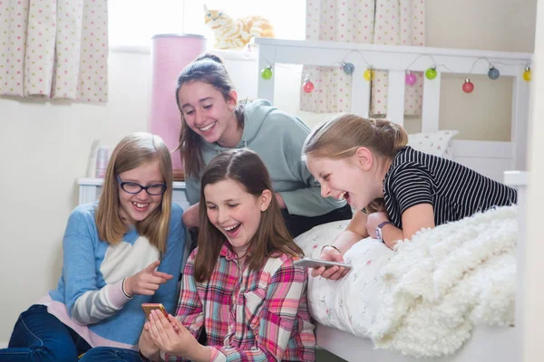 Group Of Young Girls With Mobile Phones In Bedroom — Stock Photo, Image