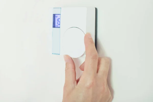 Close Up Of Female Hand On Central Heating Thermostat — Stock Photo, Image