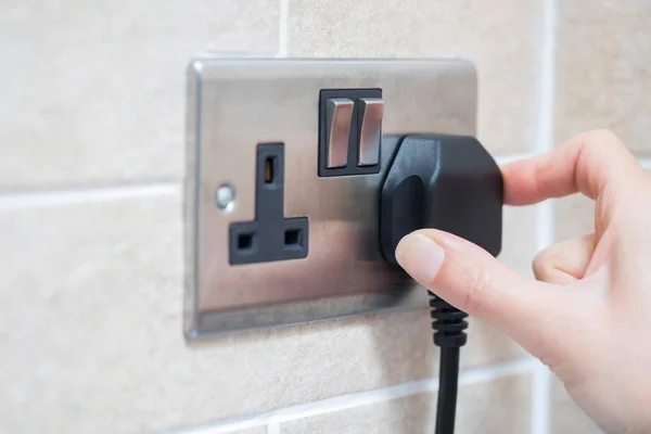 Hand Putting Plug Into Electricity Socket — Stock Photo, Image