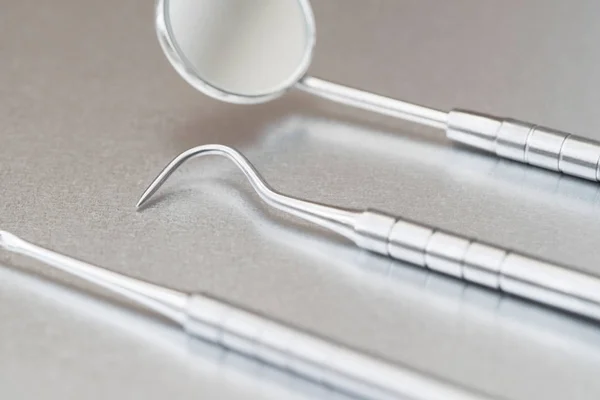 Close Up Of Dental Instruments On Metal Surface — Stock Photo, Image