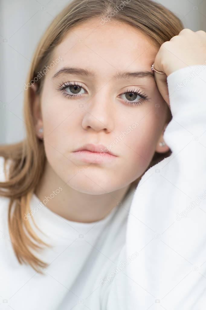 Indoor Portrait Of Unhappy Teenage Girl