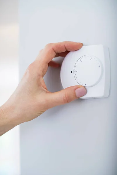Close Up Of Female Hand On Central Heating Thermostat — Stock Photo, Image