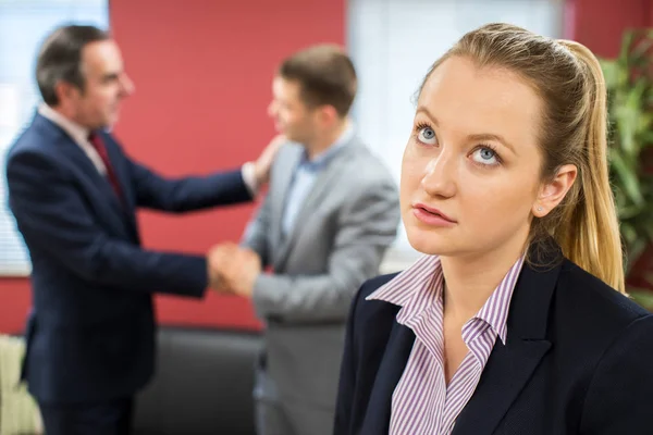 Unhappy Businesswoman With Male Colleague Being Congratulated — Stock Photo, Image
