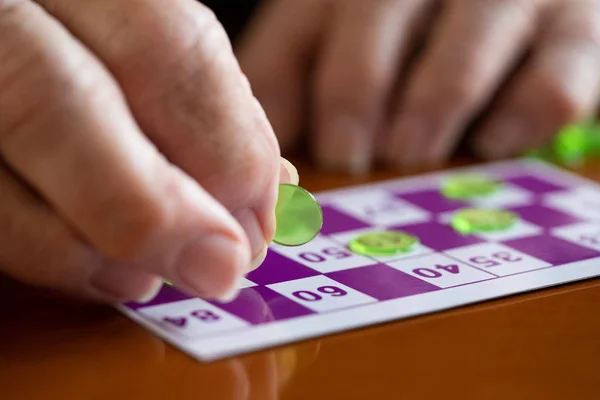 Close Up Of Senior Man Playing Game Of Bingo — Stock Photo, Image