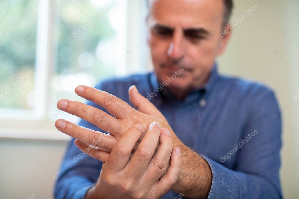 Mature Man Suffering With Repetitive Strain Injury