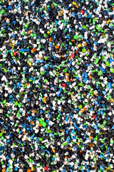 Concepto ambiental de fondo plástico reciclado triturado — Foto de Stock